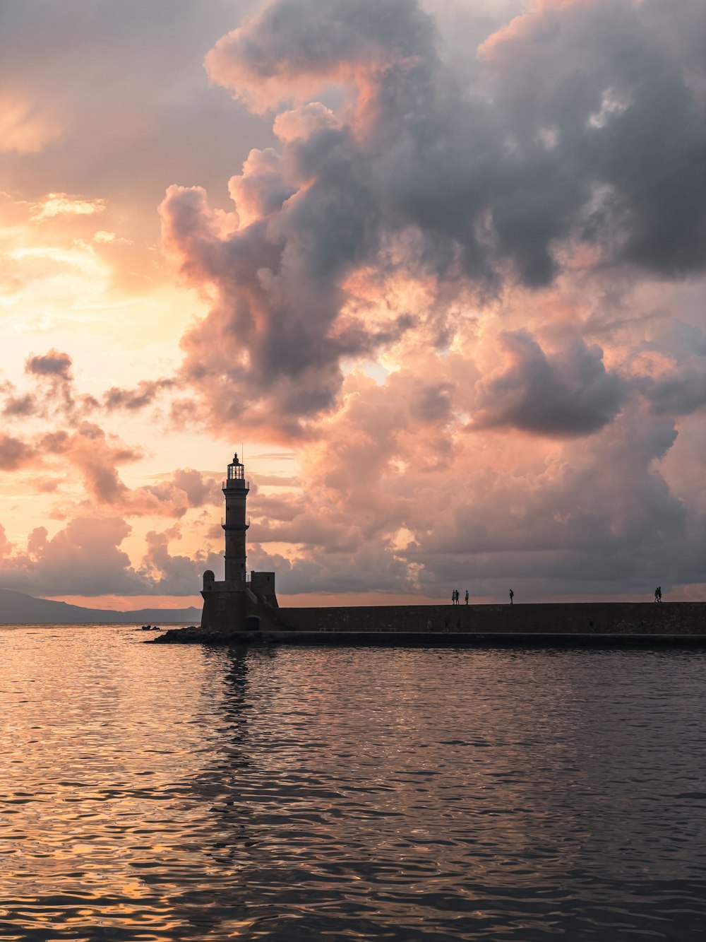 a large body of water under a cloudy sky