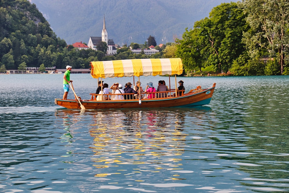 a group of people riding on the back of a boat