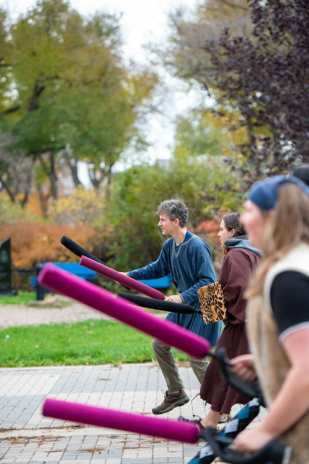 a group of people playing a game of baseball