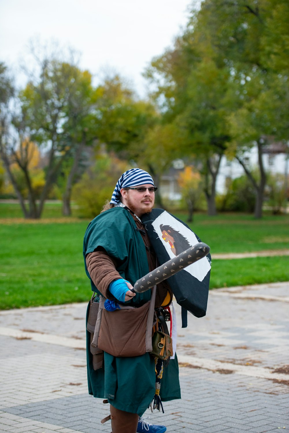 a man in a pirate costume holding a stick