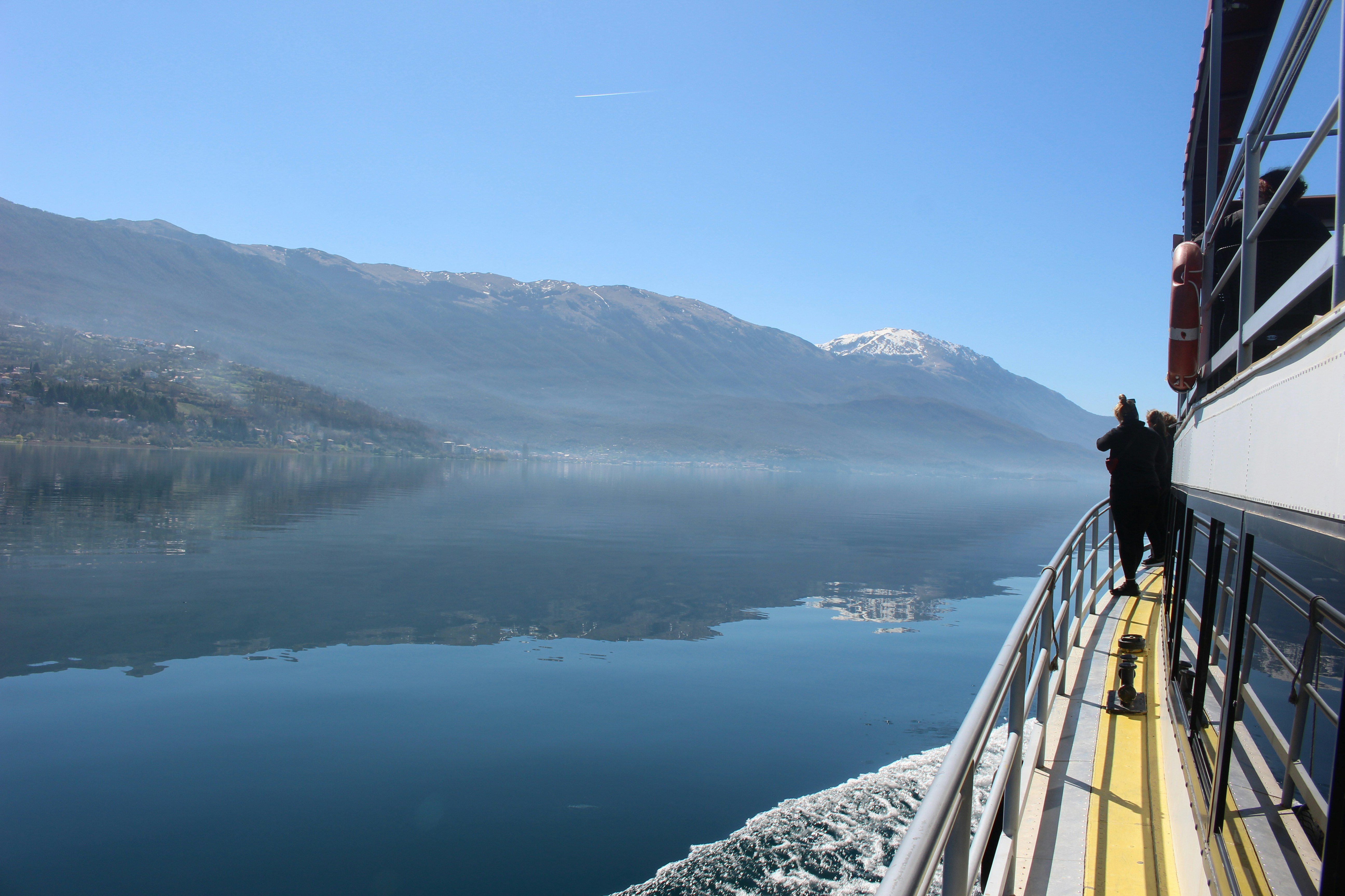 Nainital lake view with families enjoying boating and scenic mountain reflections in clear water