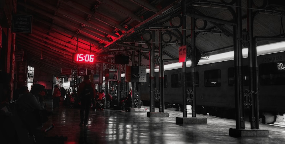 a black and white photo of a train station