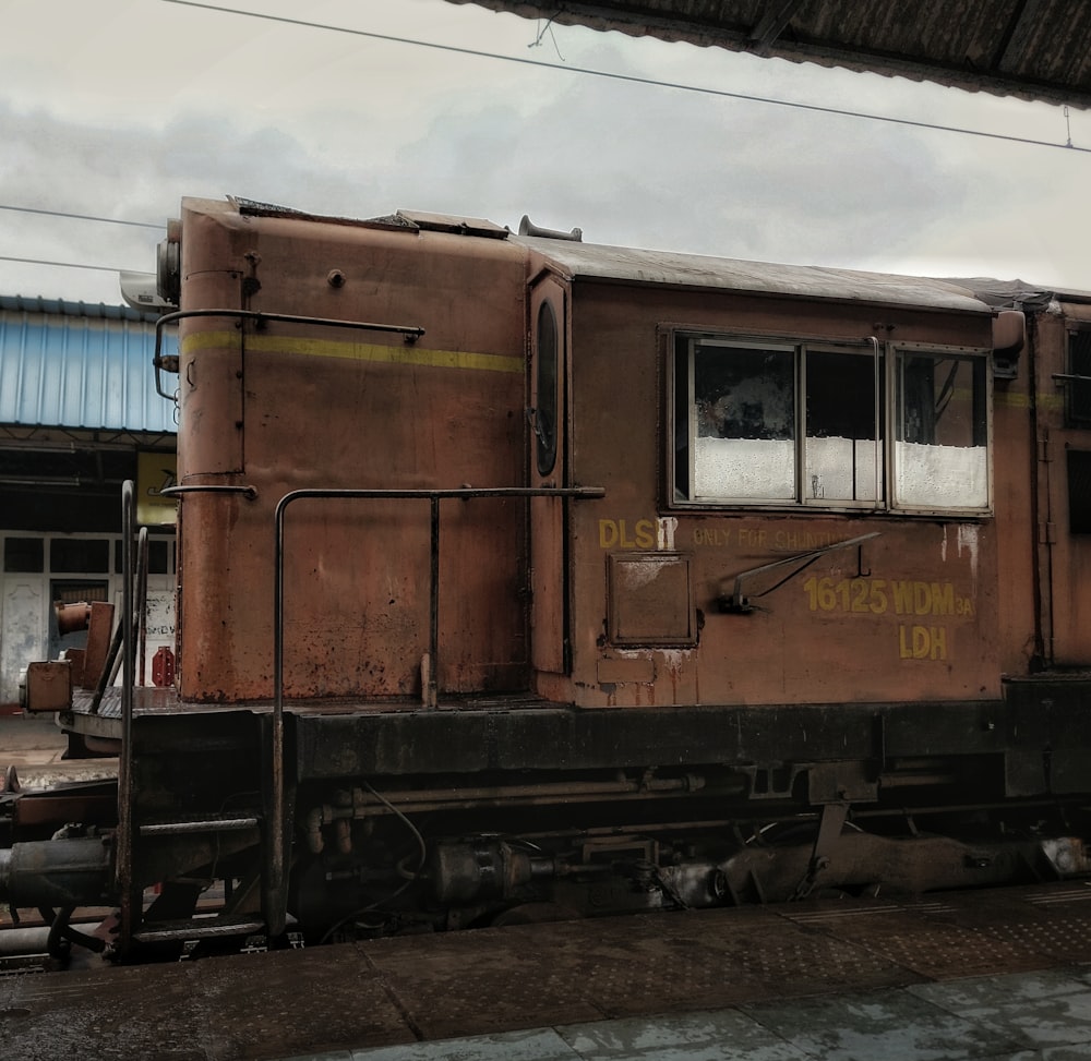 a rusted out train sitting on the tracks