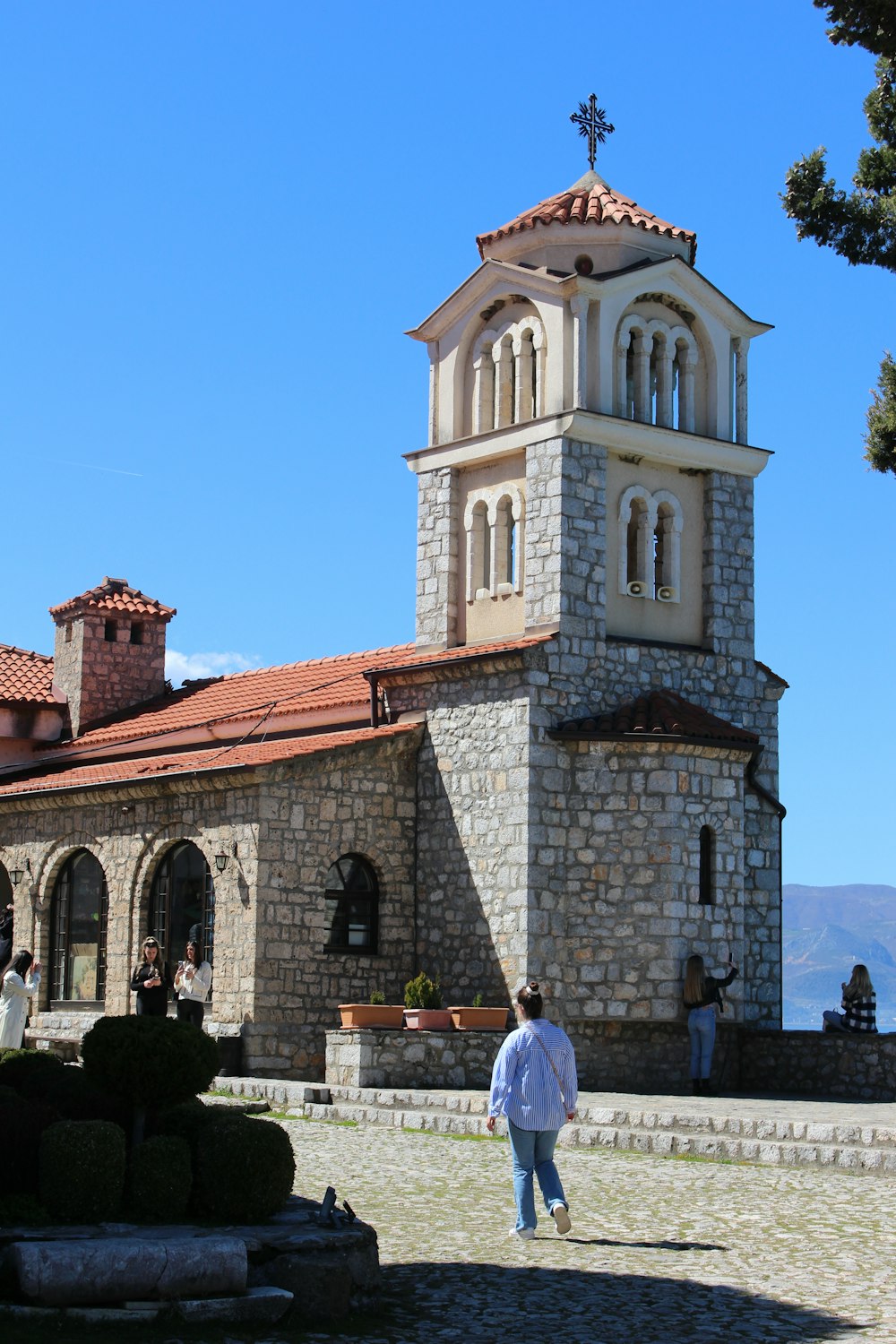 a man walking in front of a church