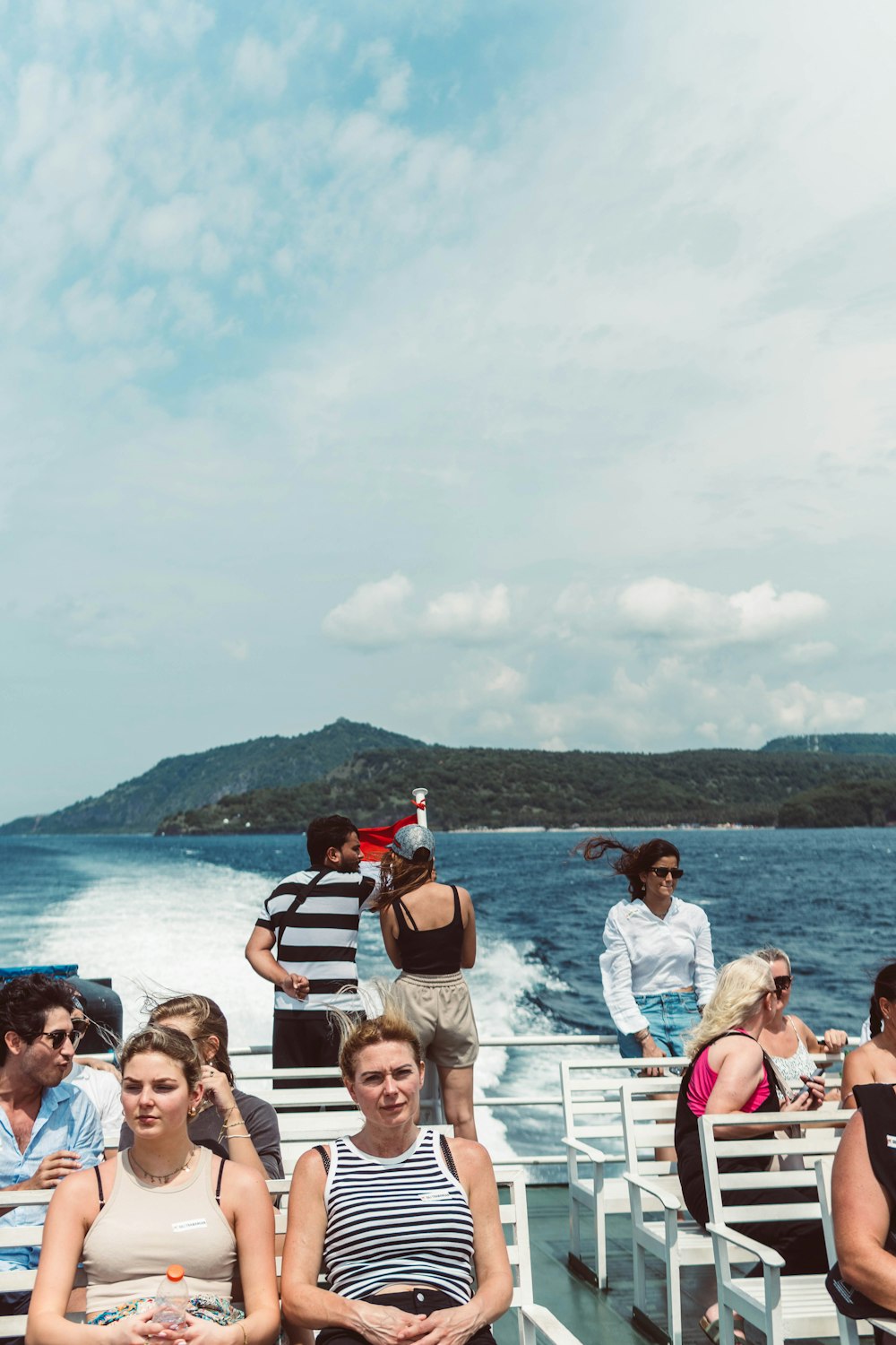 a group of people sitting on top of a boat