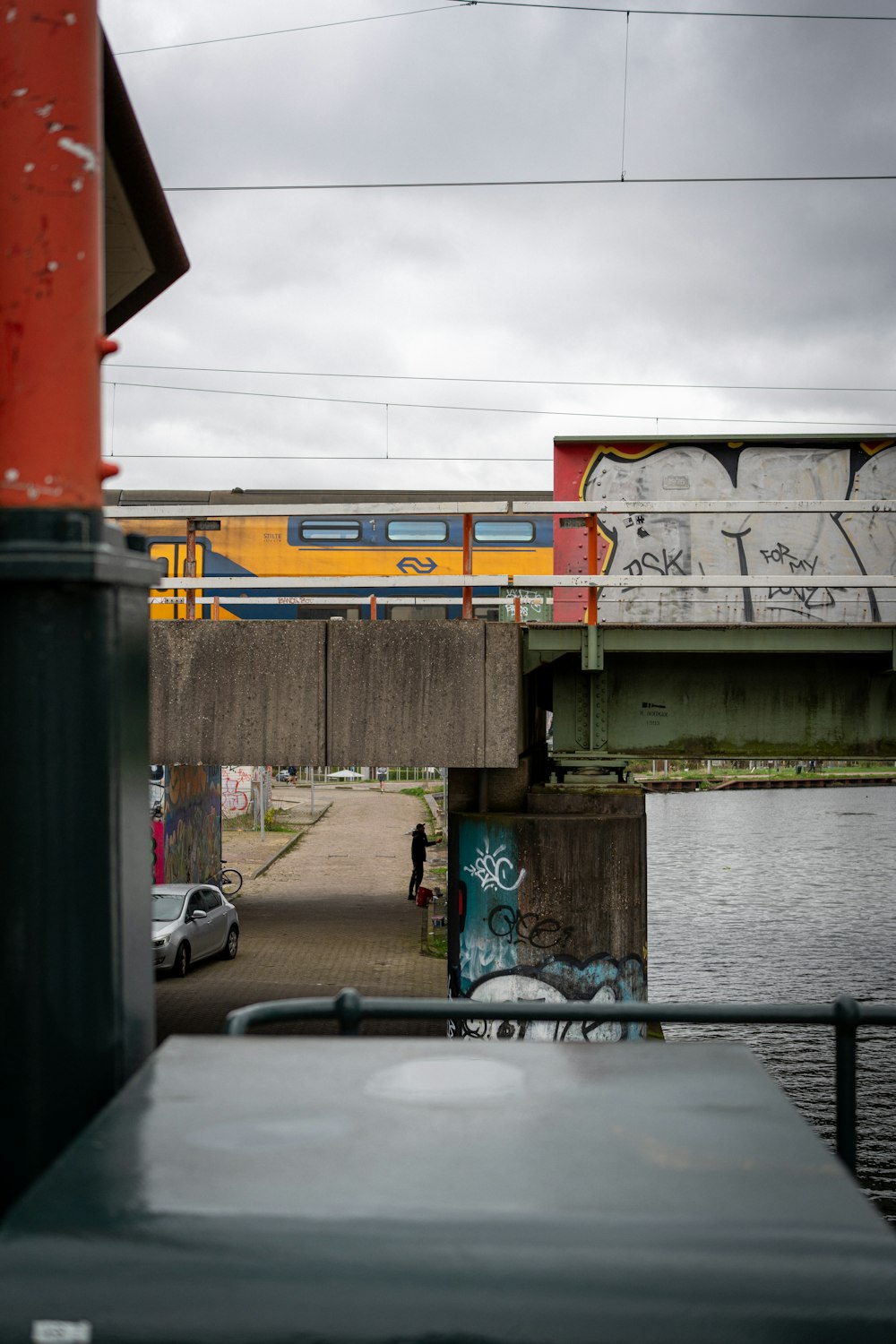 a train traveling over a bridge over a body of water