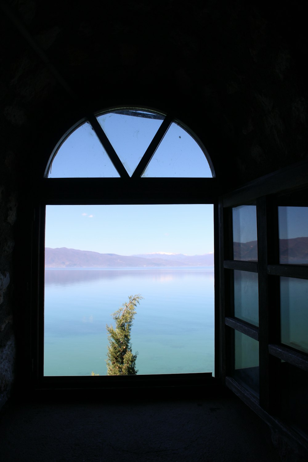 a window with a view of a lake
