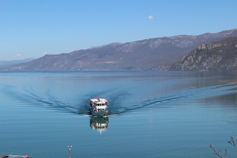 a boat traveling across a large body of water