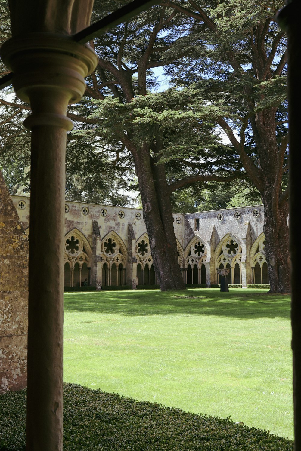 a view of a large building through the trees