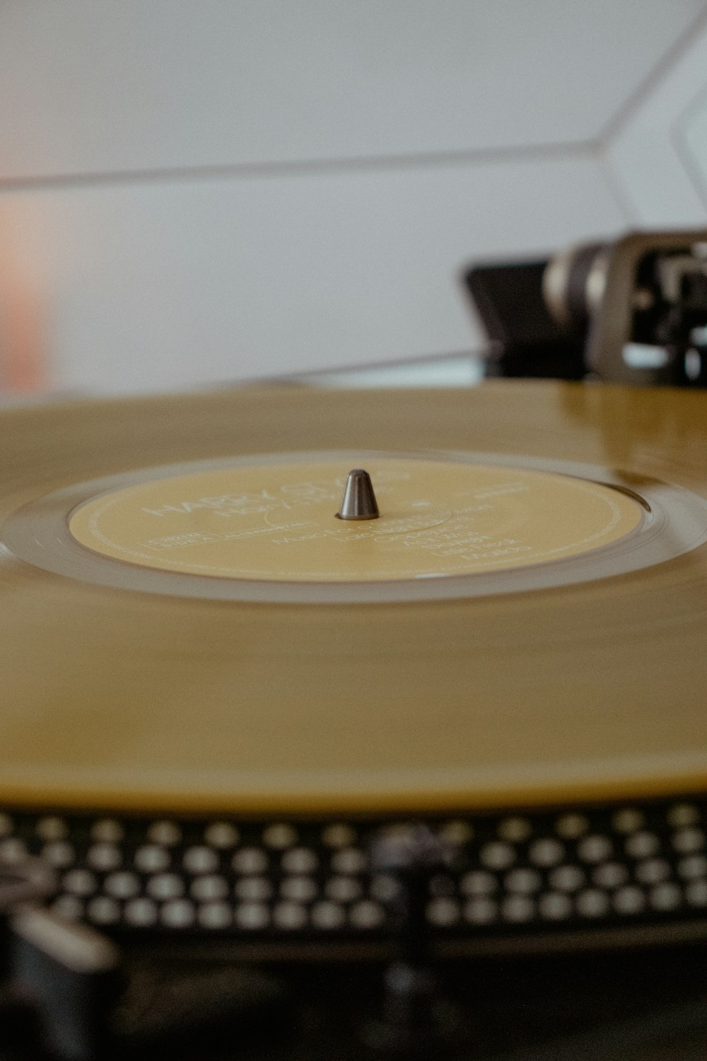 a record player with a yellow record on top of it