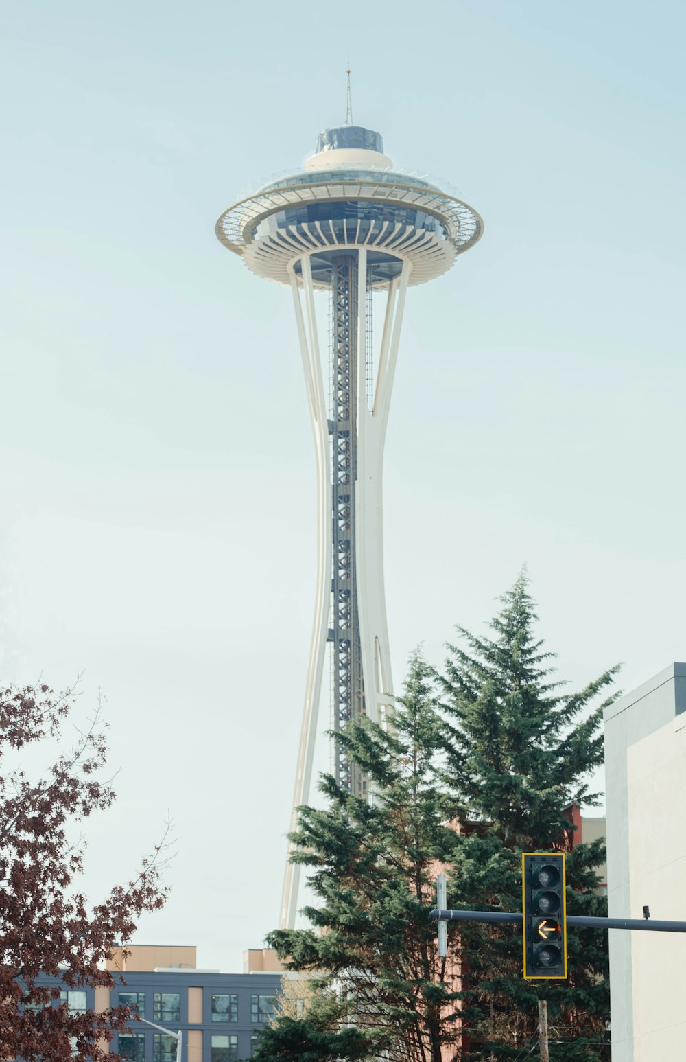 a tall building with a very tall tower in the background