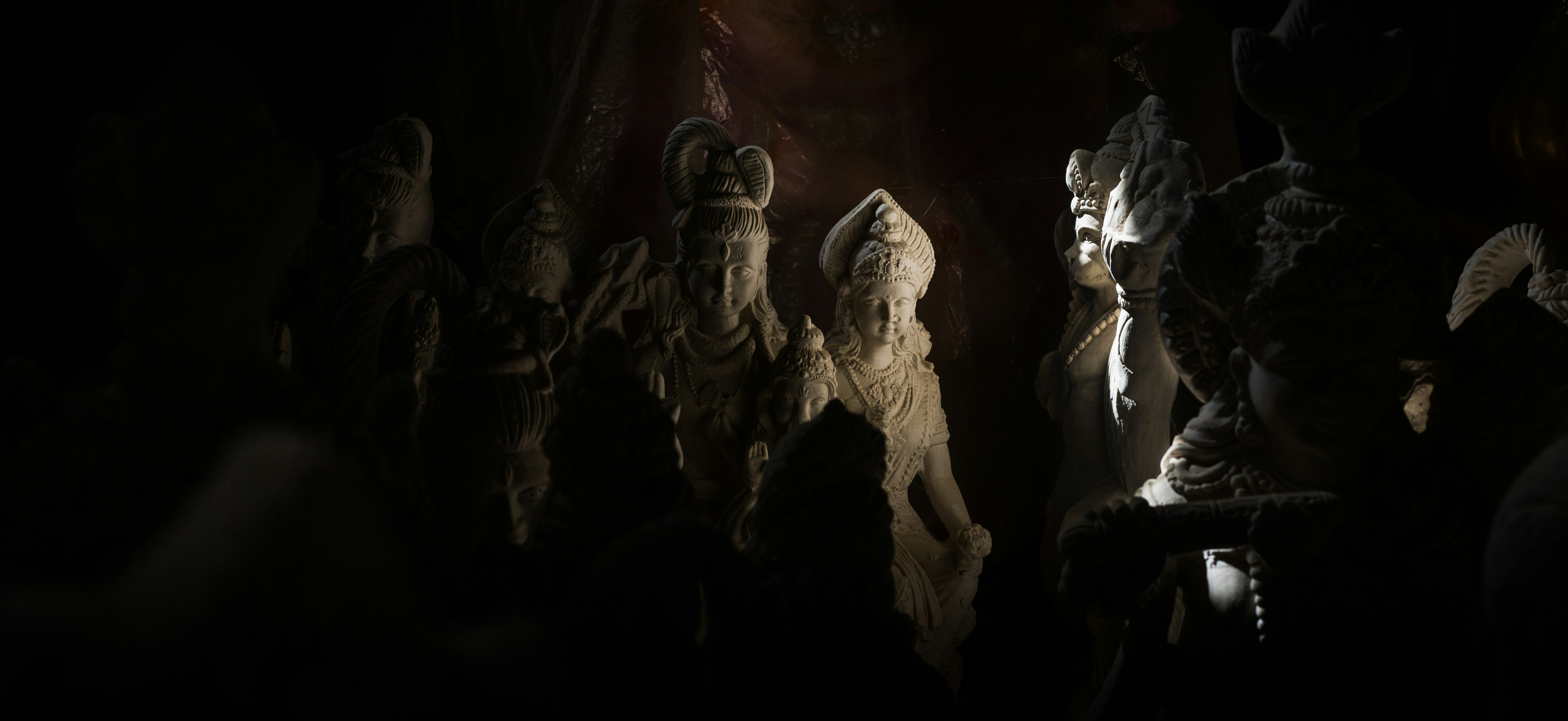 woman wearing yellow long-sleeved dress under white clouds and blue sky during daytime