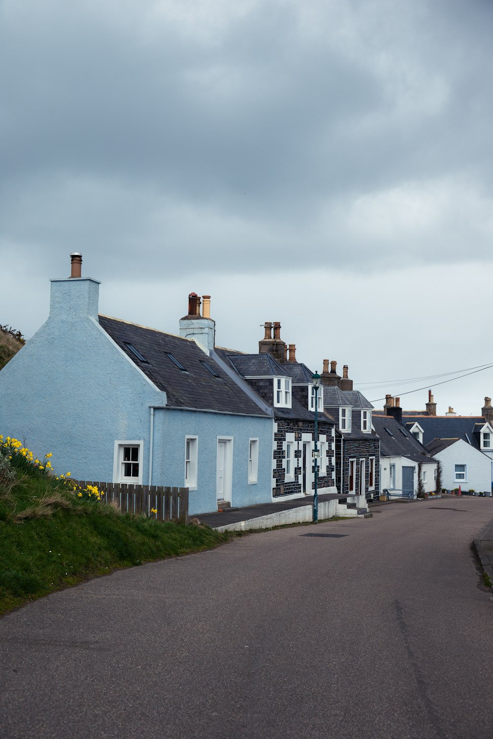 a row of houses on the side of a road