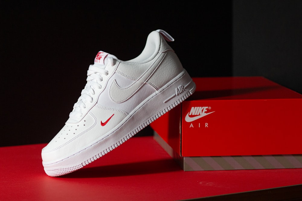 a pair of white nike air force sneakers