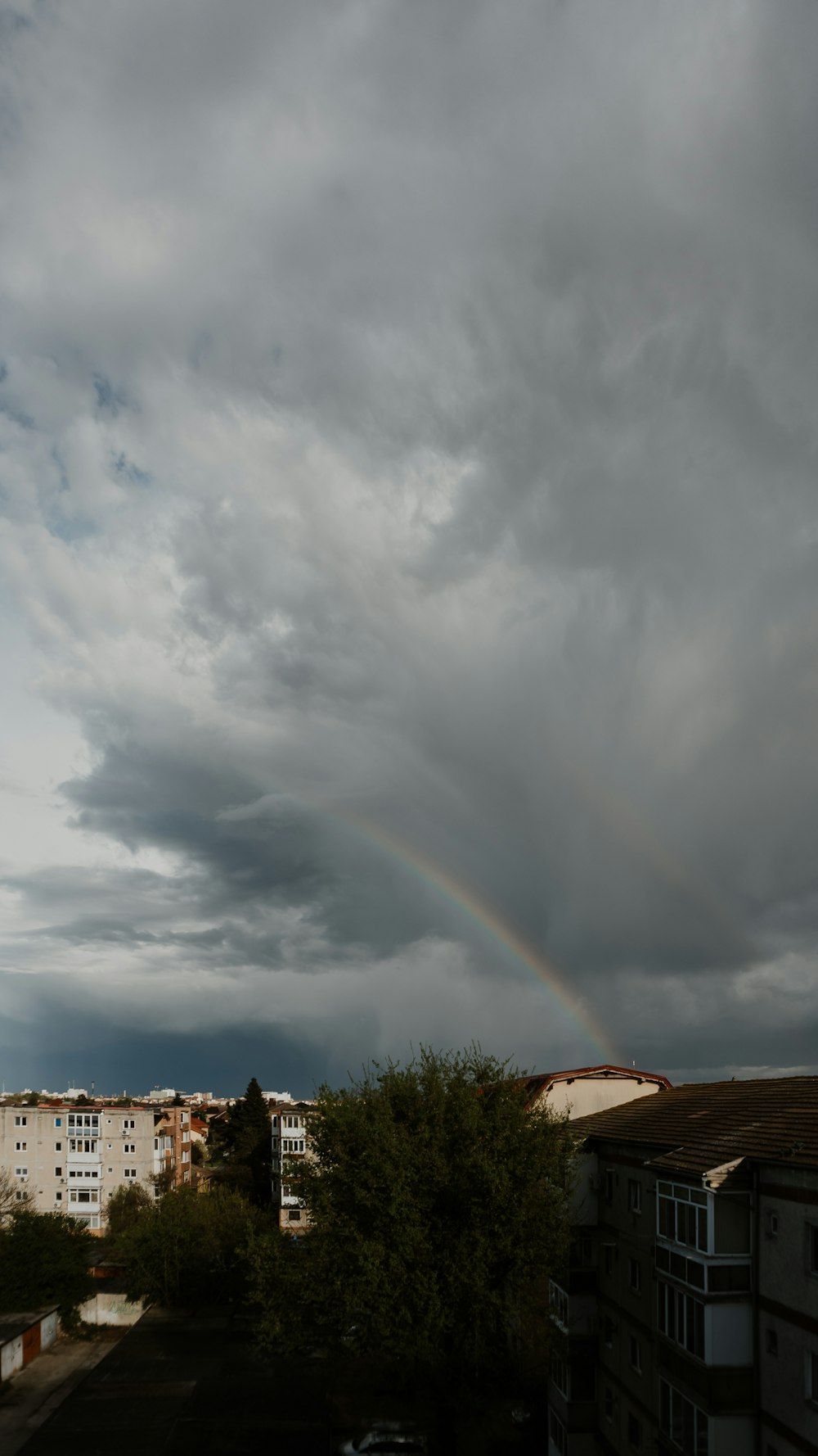 a rainbow in the sky over a city