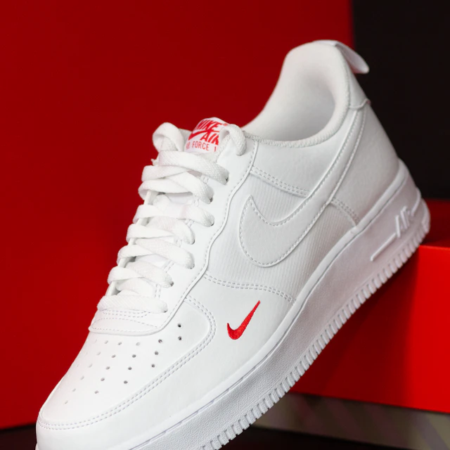 A pair of white Nike Air Force 1 sneakers