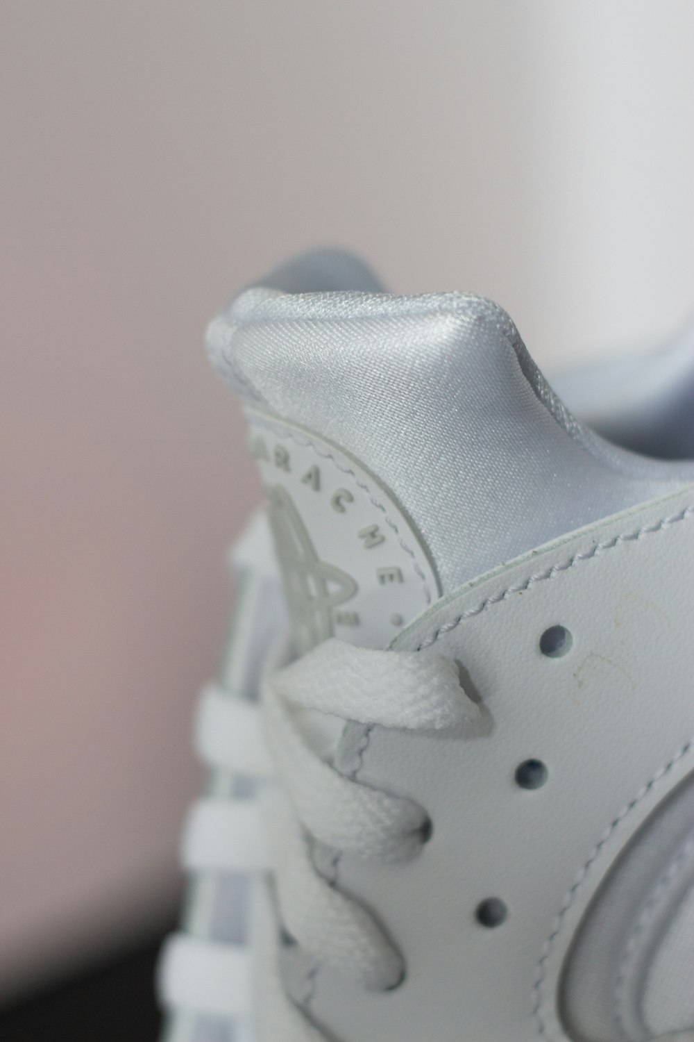 a close up of a white tennis shoe