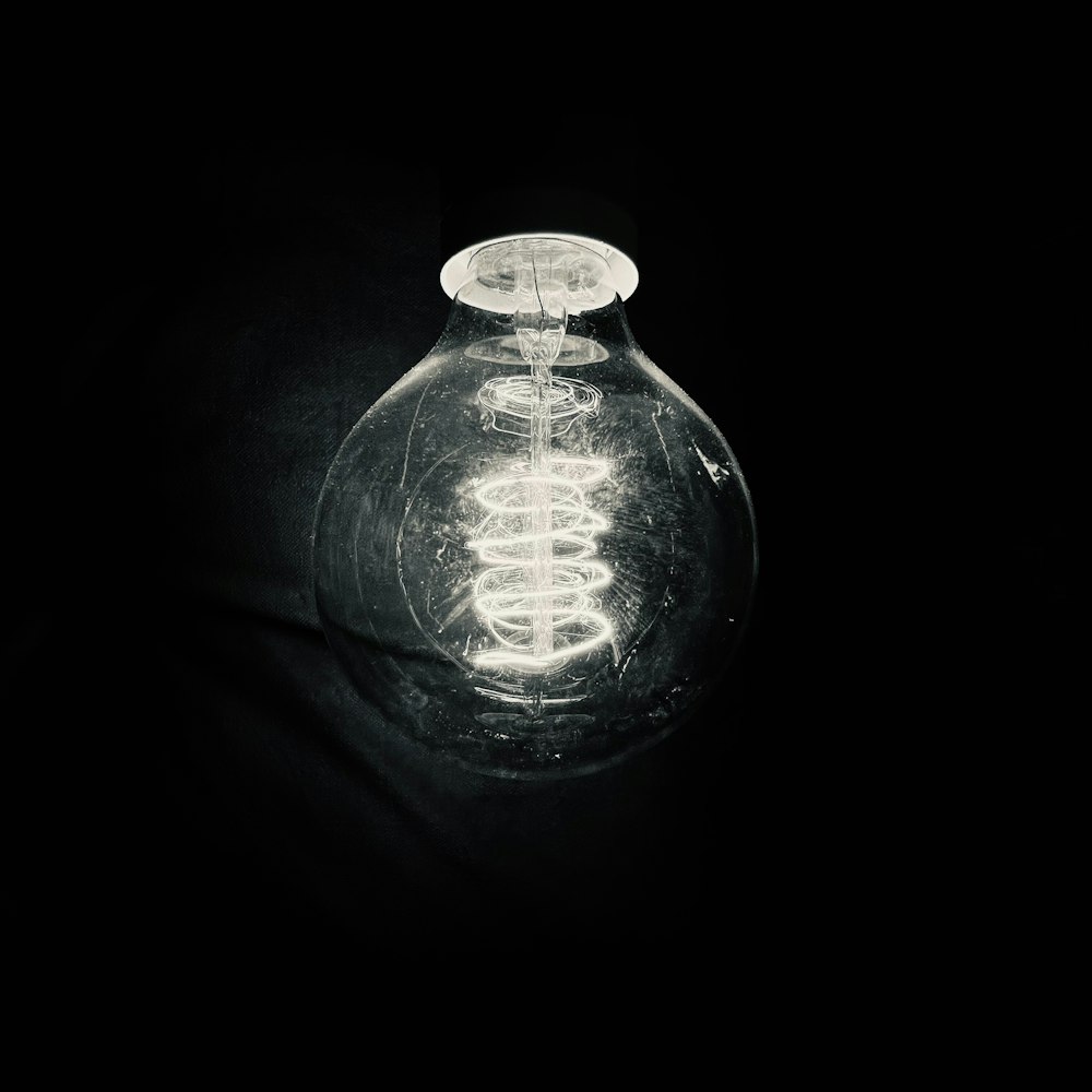 a black and white photo of a light bulb