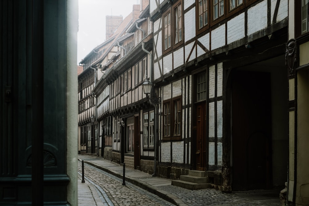 a cobblestone street lined with old buildings