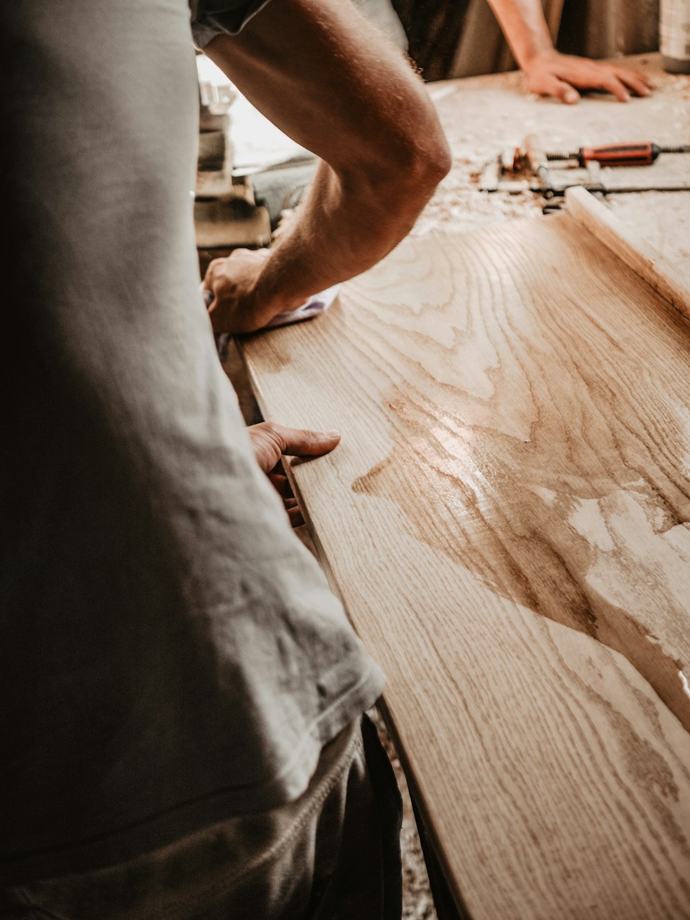 a man working on a piece of wood