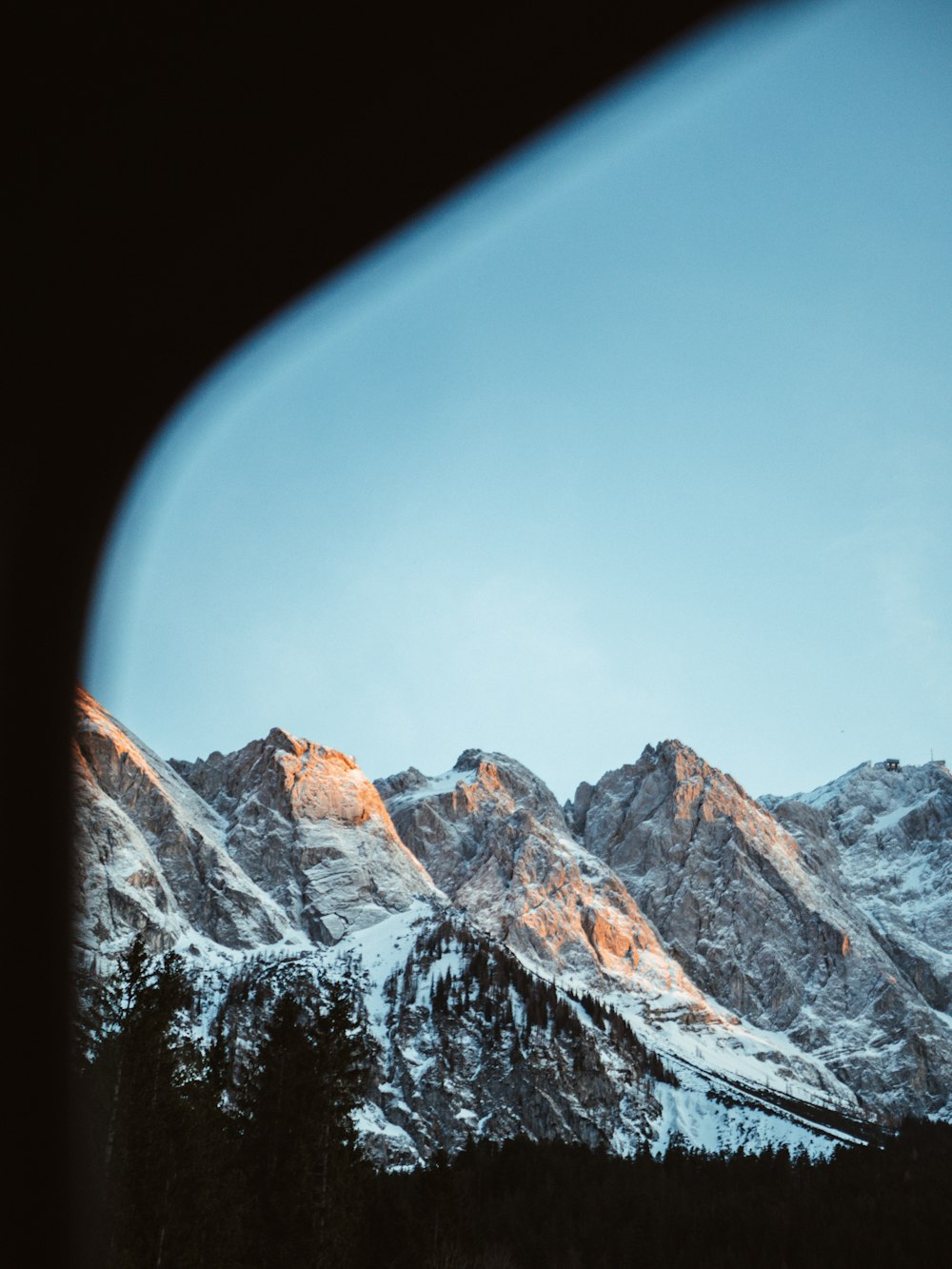 a view of the mountains from a plane window