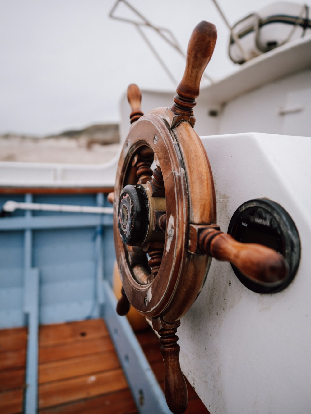 a close up of a steering wheel on a boat