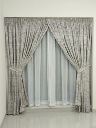 a window with a curtain and a window valance