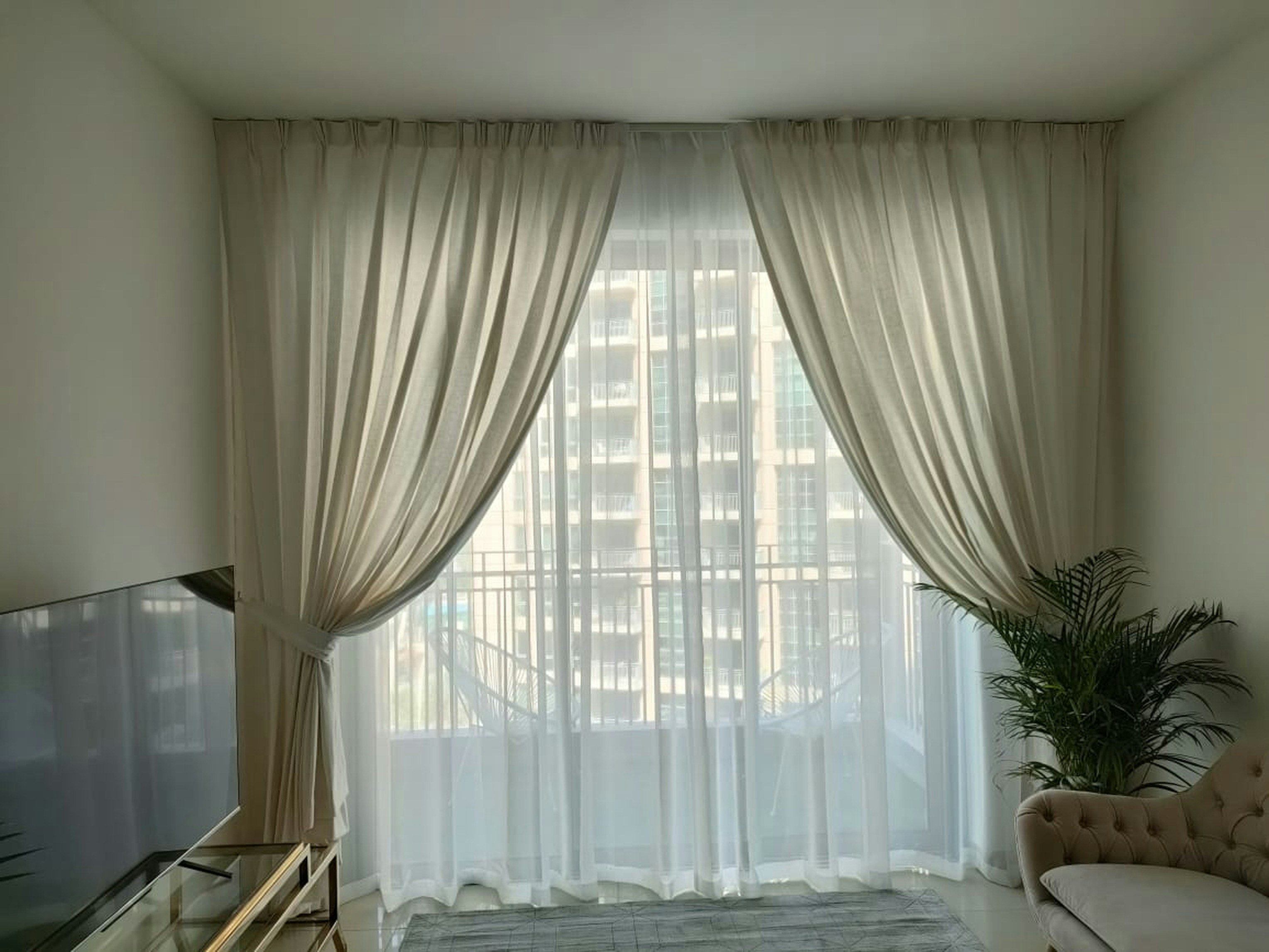 a living room with a couch and a tv