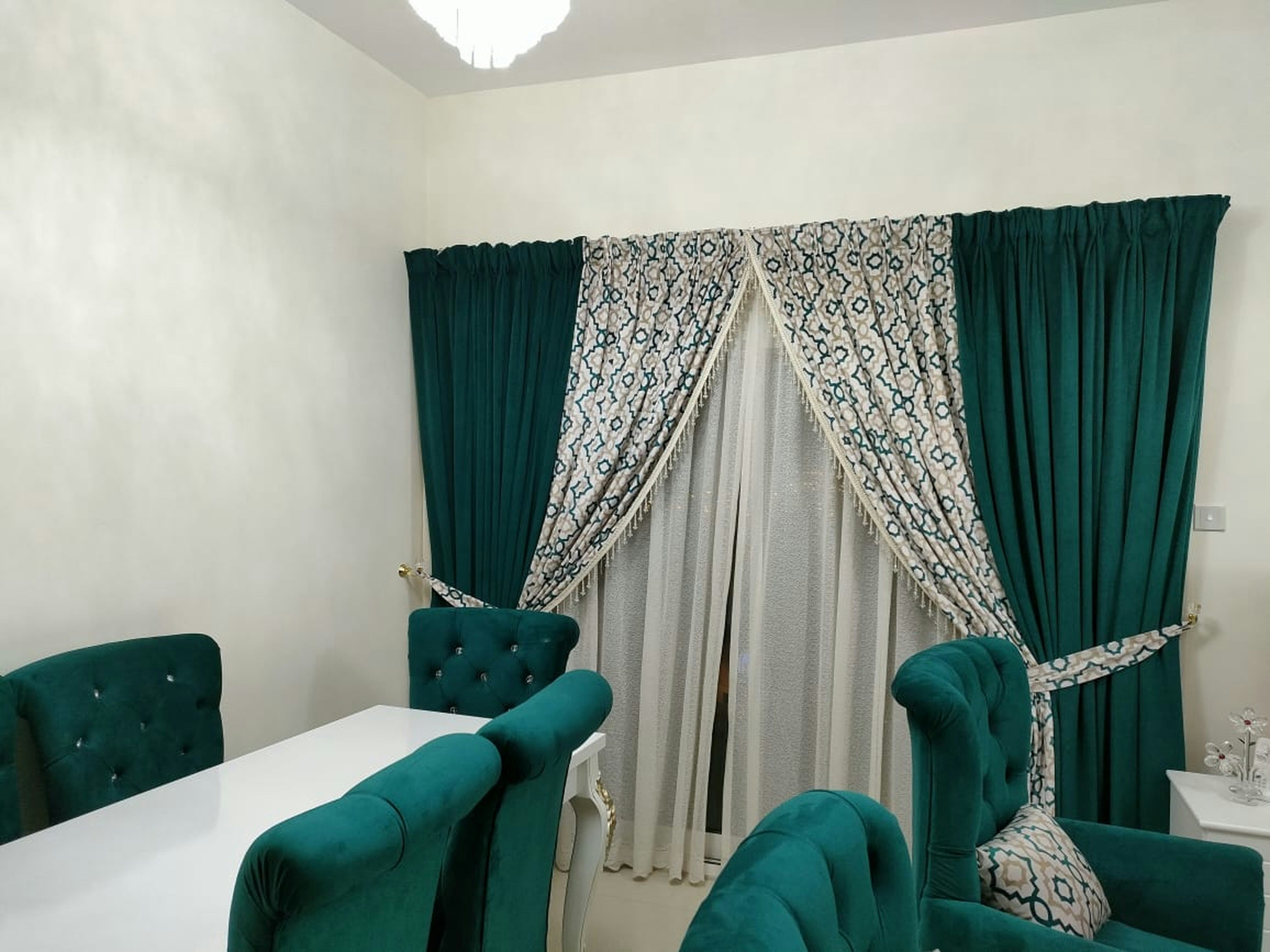 Floor-to-ceiling curtains creating luxury soundproofing decor in a modern apartment living room