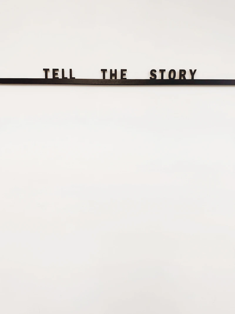 a sign that says tell the story on it