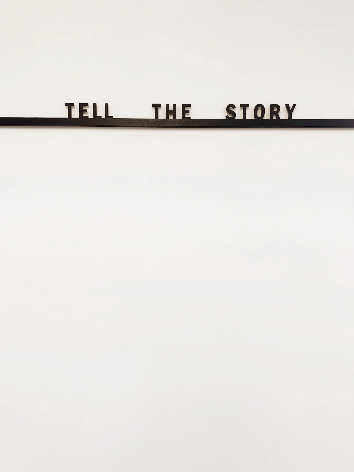 a sign that says tell the story on it