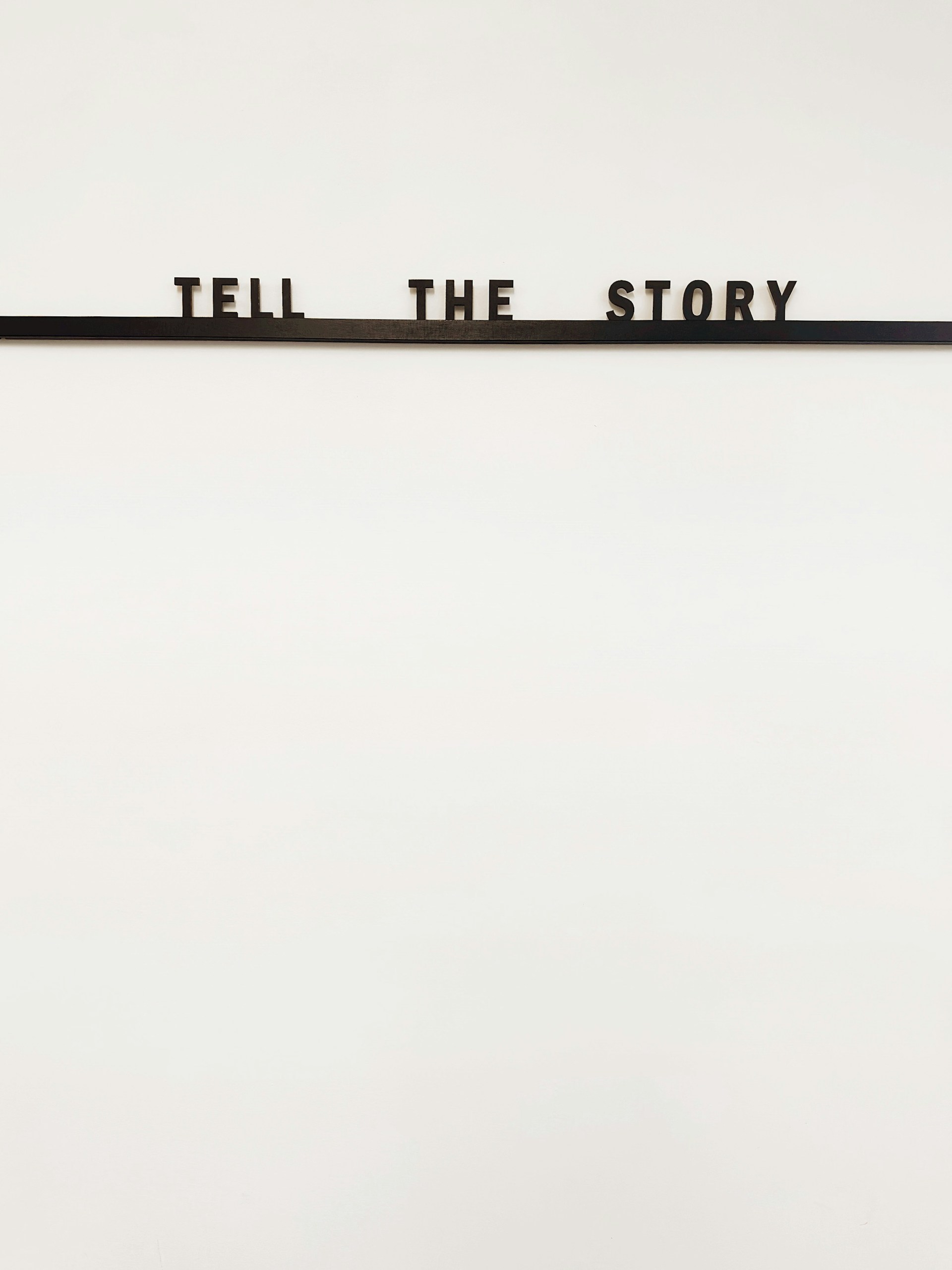 a sign that says tell the story on it