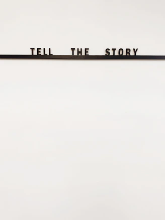 a sign that says tell the story on it