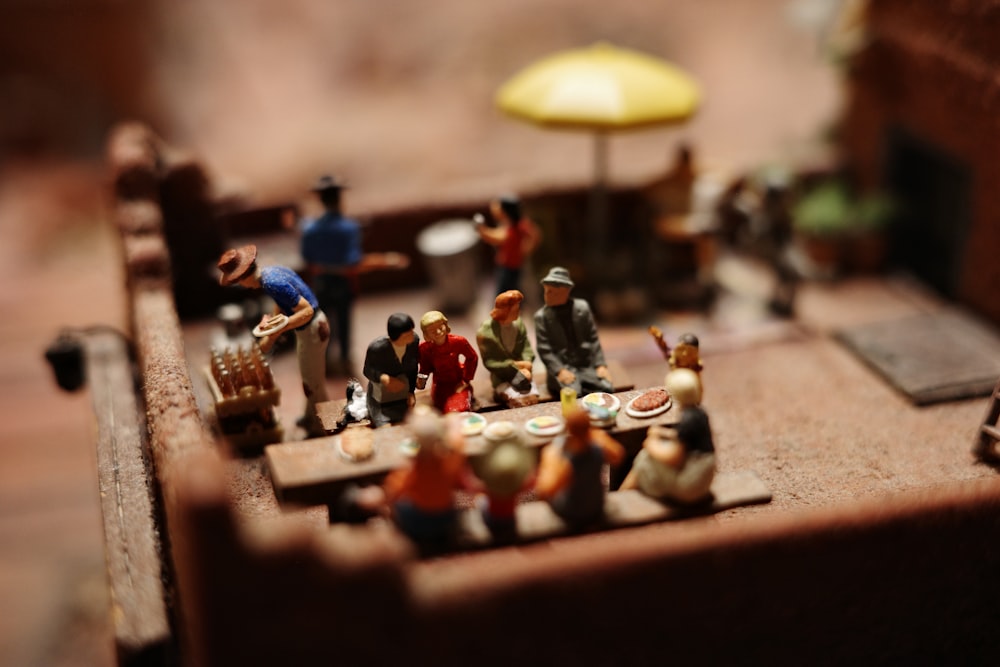 a group of small figurines sitting on top of a table