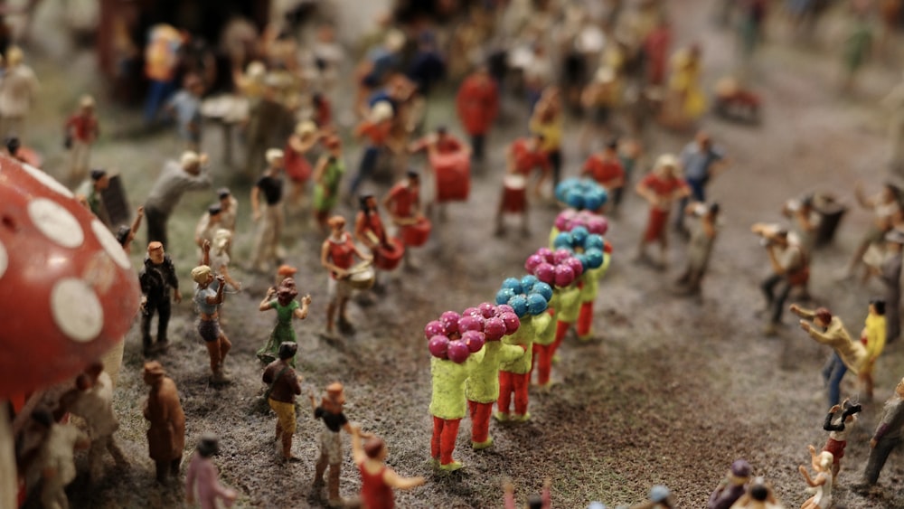 a group of toy figurines are standing in a circle