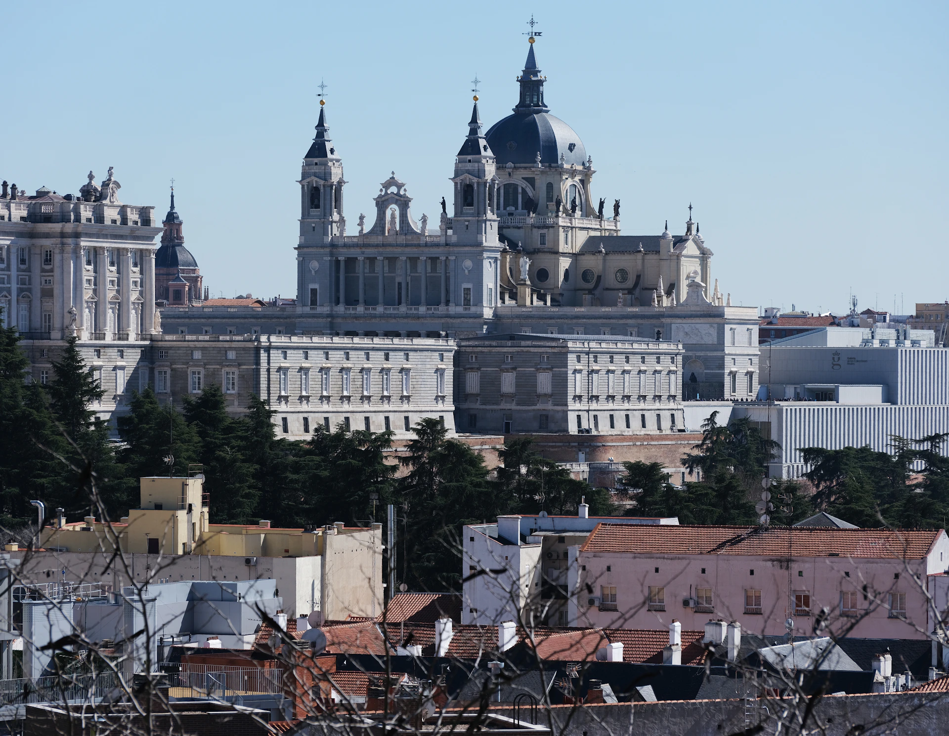 a view of a city with a large building in the background