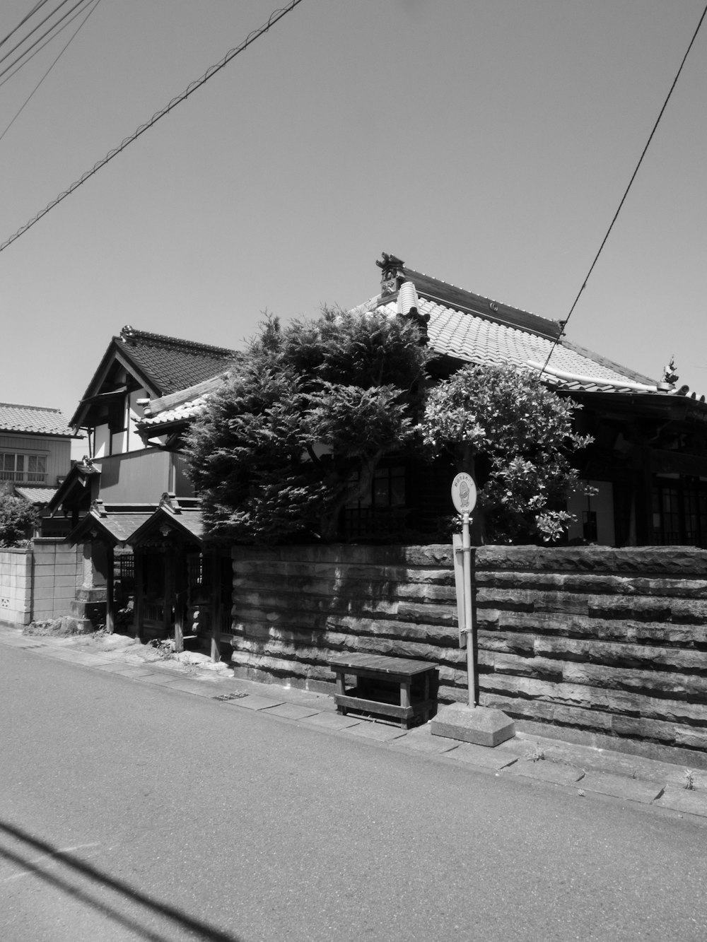 a black and white photo of a street corner