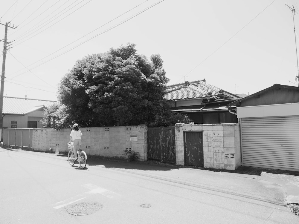 a person riding a bike down a street