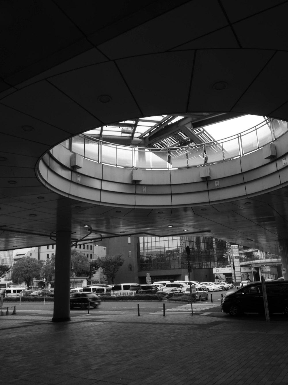 a black and white photo of a parking garage