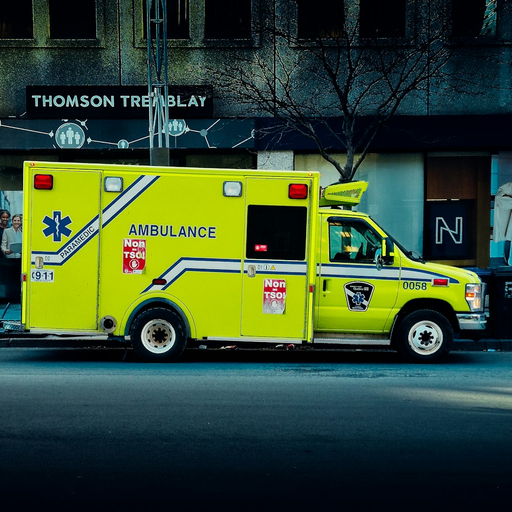 an ambulance is parked on the side of the street