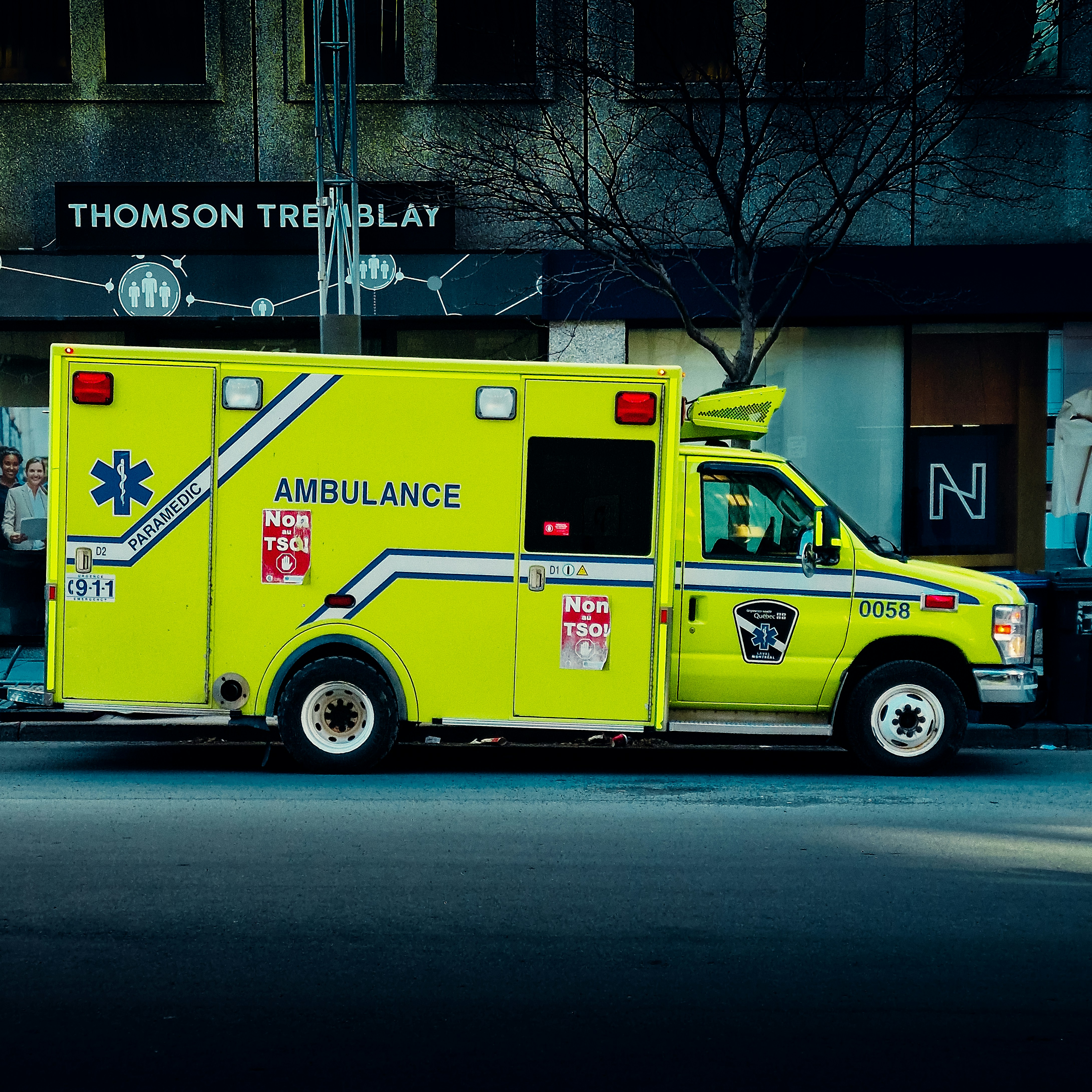 an ambulance is parked on the side of the street