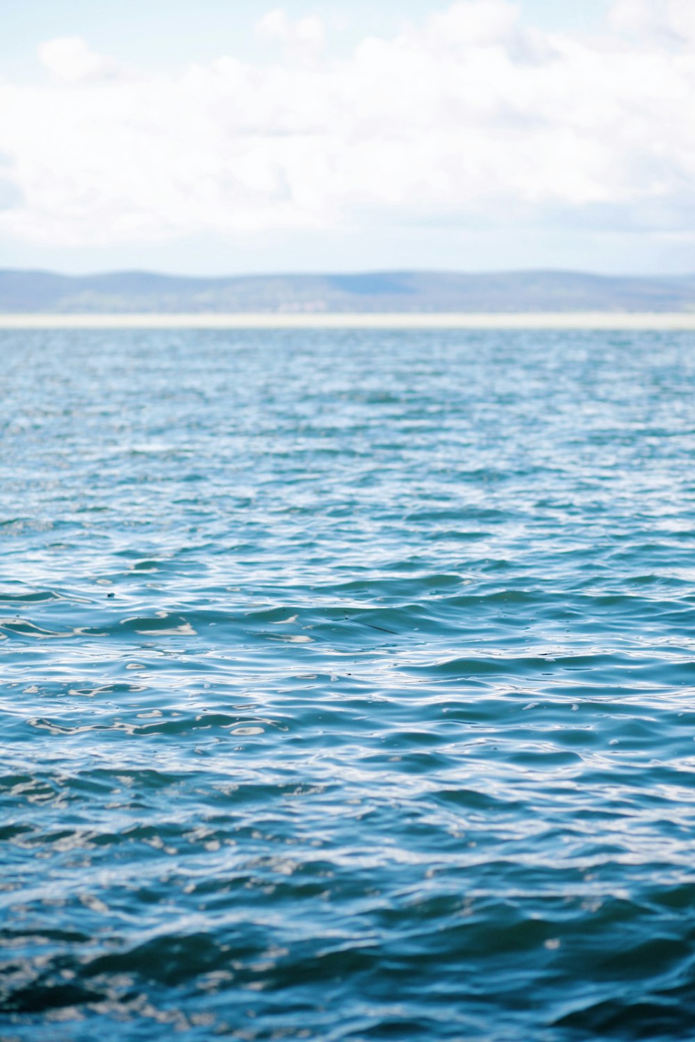 a person riding a surf board on a body of water