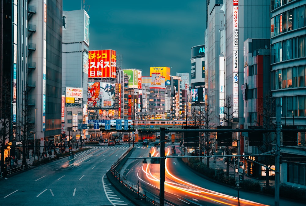 a city street filled with lots of tall buildings