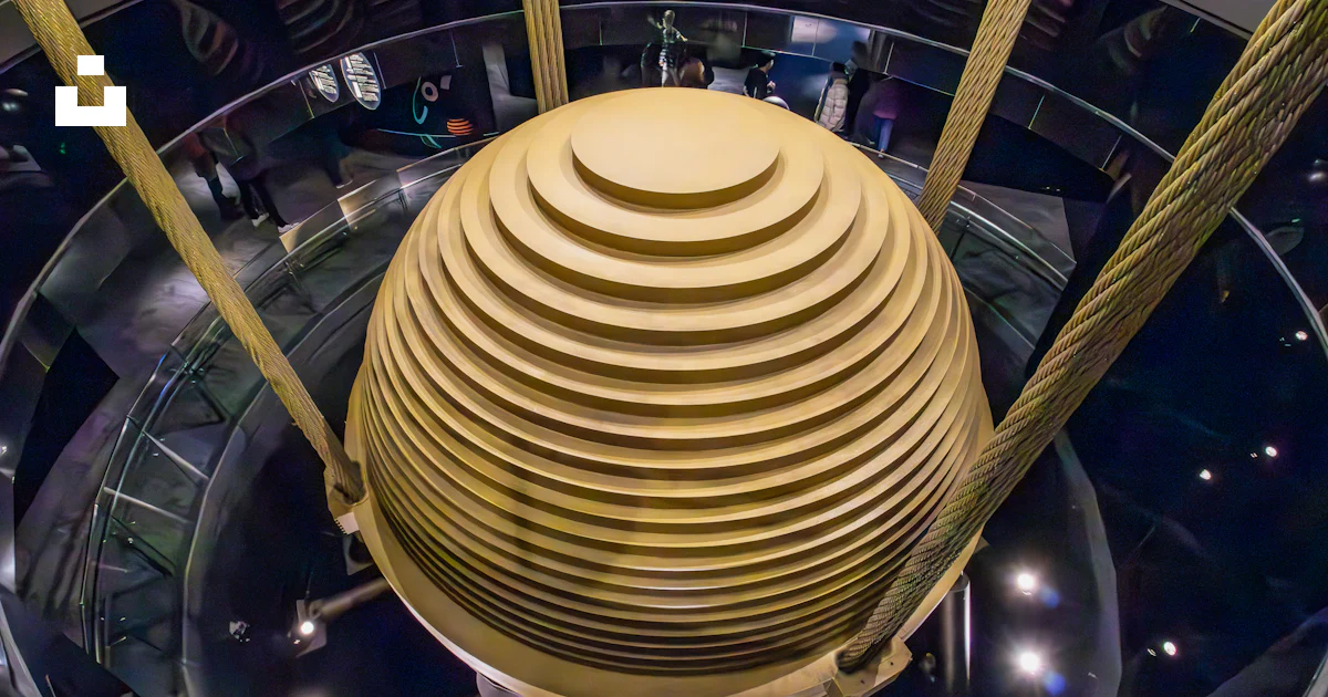 A Single Rounded Structure A very tall building with a very large round structure photo – Free ...