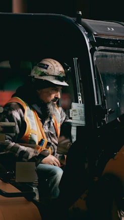 a man sitting in the back of a truck
