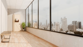 a room with a bench and a large window