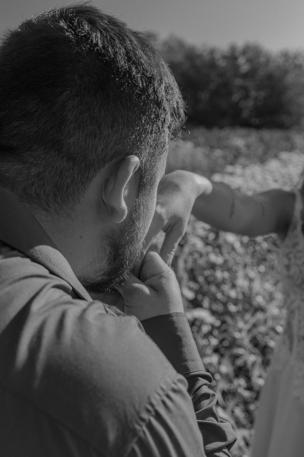 a man and a little girl in a field