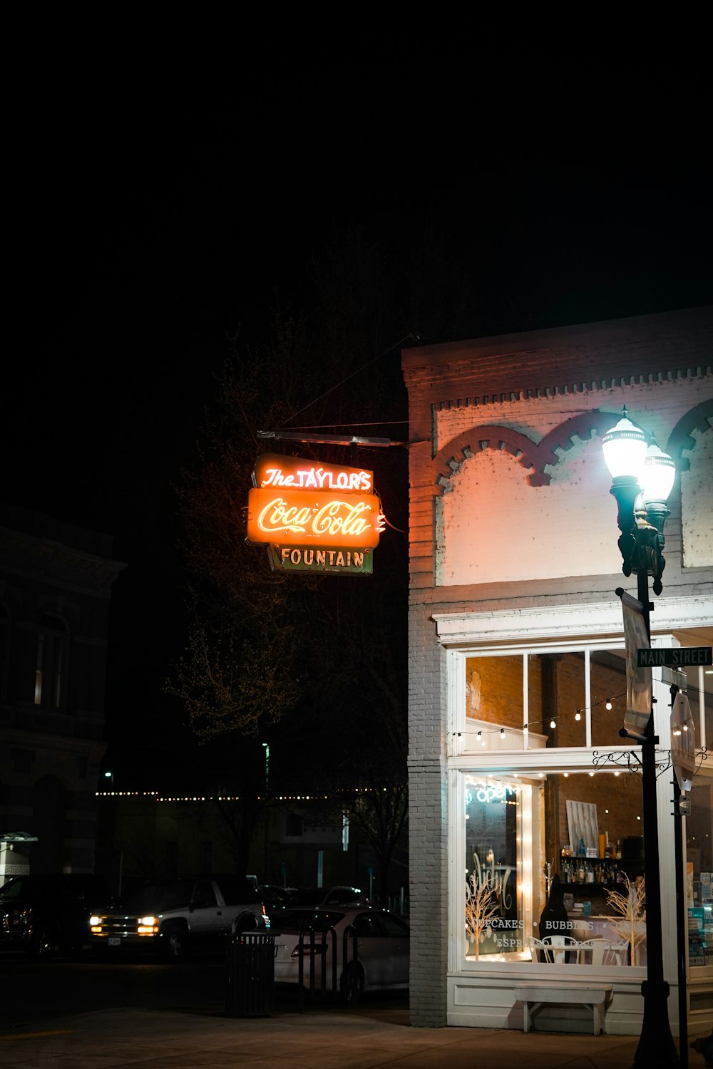 a building with a neon sign on the side of it