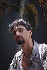 a man with a beard and a flowered shirt