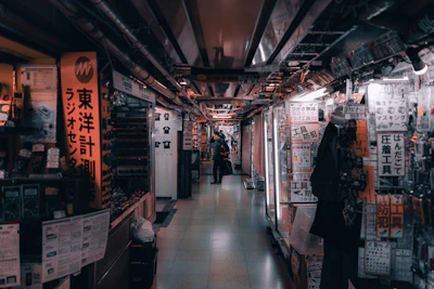 a man is walking down a long hallway
